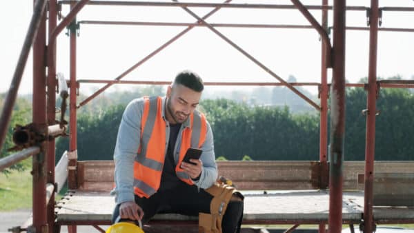a man on his phone in construction site