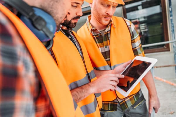 3 Person analyzing plans on tablet