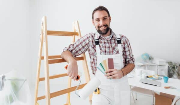A Painter smiling at the camera